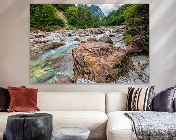 Red rocks in a mountain river by Menno van der Haven