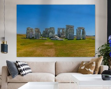 Stonehenge under a brilliant blue sky by Jurjen Jan Snikkenburg