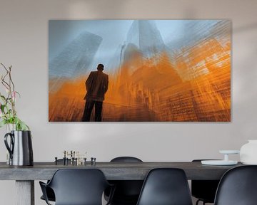 Businessman in front of futuristic cityscape in orange and blue