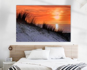 Orange sky at sunset with sea shore coast and dune by Ben Schonewille