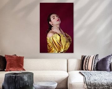 Portrait of a Woman with Golden Satin Blouse and Red Background