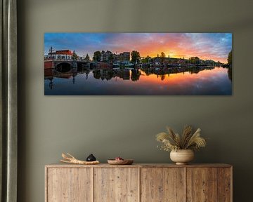 View of the Amstel River (east side) and the Walter Süskind Bridge in Am