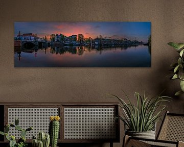 View of the Amstel River (east side) and the Walter Süskind Bridge in Am