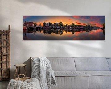 View of the Amstel River (east side) and the Walter Süskind Bridge in Am