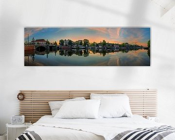 View of the Amstel River (east side) and the Walter Süskind Bridge in Am