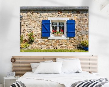 Colourful window in the hamlet of Montourgard, Brittany