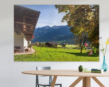 Alpine pasture with farmhouse and mountains by Torsten Krüger