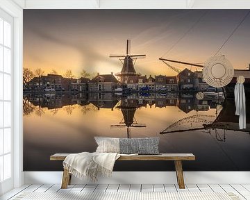 Molen De Vlijt in Meppel weerspiegeld met zonsondergang