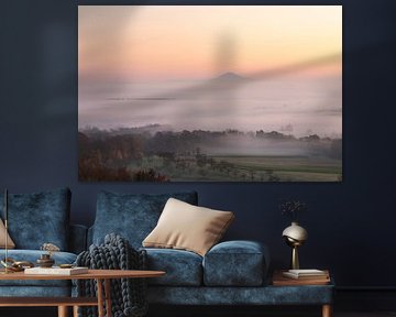 Hohenstaufen in a sea of fog with delicate colours at sunrise.