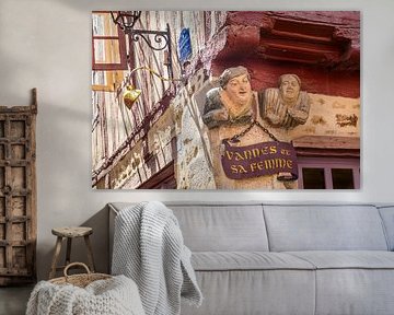 Funny figures on a half-timbered house in the old town centre of Vannes, Brittany