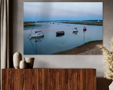 Ribbon of boats at sunset by Jos van den Berg