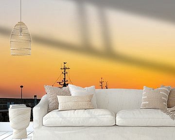 Sunset and fishing boats in the harbour of the town of Sassnitz on by Rico Ködder