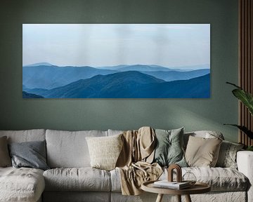 Far landscape of the Carpathian Mountains against a blue sky