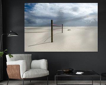 Volleyball net in the Wadden Sea on the North Sea by Alexander Baumann
