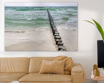 Groyne in the Baltic Sea with green waves