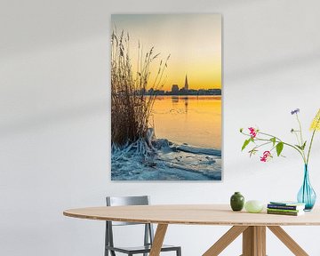 View over the Warnow to Rostock in winter with sunrise by Rico Ködder