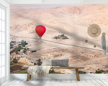 Red hot air balloon over the ancient temples of Luxor, Egypt by Bart van Eijden