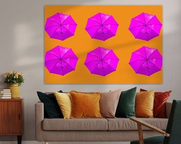 Pink umbrella's on orange background by Patricia Hofmeester