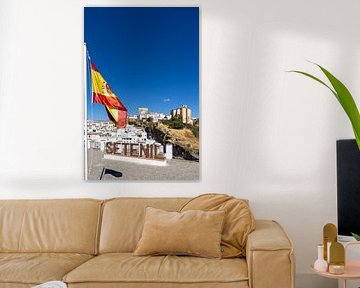Panorama or skyline of a historic old town with many white houses. The Spanish flag in Setenil de las Bodegas, Cádiz, Andalusia, Spain by Fotos by Jan Wehnert