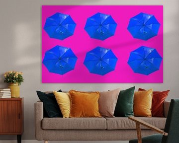 Blue umbrella's on pink by Patricia Hofmeester