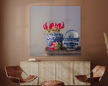 Still life Flame lily with ginger jar and stacked bowls by Oda Slofstra