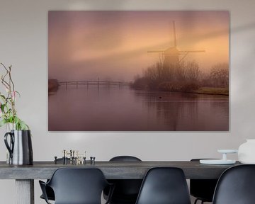Moulin de Kinderdijk dans le brouillard sur Mark Bolijn