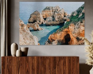 Fisherman among the cliffs of Ponta da Piedade by Rachel Mein