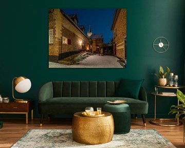 Elsloo in de avond in de winter met sneeuw