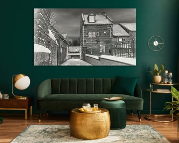 Elsloo am Abend im Winter mit Schnee in Holzkohle