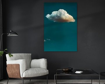 Lone white cloud against dark blue sky by Roger VDB