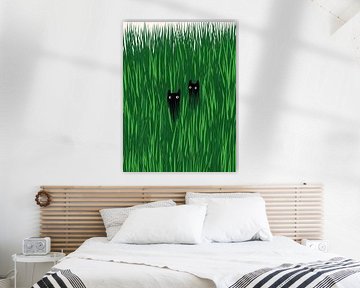 Deux chats noirs dans les hautes herbes