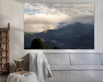 Clouds in the valley are warmed by the sun.