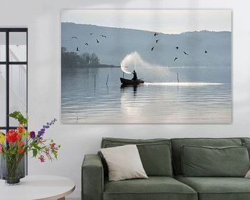 Fisherman on Lake Trasimeno at sunrise