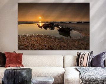 Sunset of the English shipwreck Épave Du Lord Grey on the coast in France. by Rob Christiaans