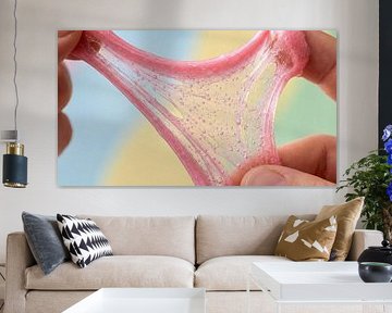 Hands stretching pink glitter slime with bubbles by Markus Gann