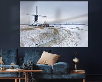 Mill world heritage site Kinderdijk in snow by Mark den Boer