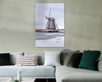 Mill world heritage site Kinderdijk in snow by Mark den Boer
