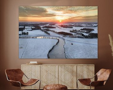 Vecht river flowing through a snowy winter landscape during sunset by Sjoerd van der Wal Photography