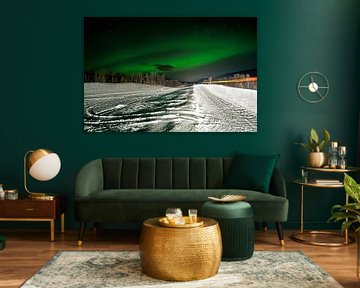 Northern lights over a winter road in Norway by Anjo Kan