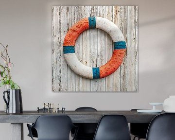 Old lifebuoy on wooden wall