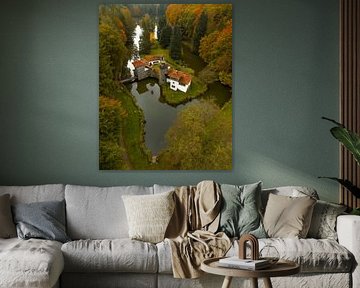 Historic castle in Luxembourg surrounded by colourful autumn forest by Ewold Kooistra