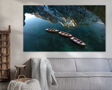 Rowing boats with reflection in the waters of Lago di Braies by Ewold Kooistra