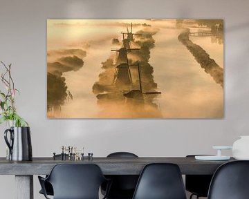 Misty Morning at Kinderdijk - Windmills in Golden Light by Ewold Kooistra