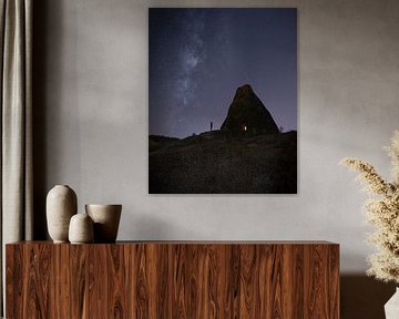 Starry sky above a rock dwelling in Turkey by Ewold Kooistra