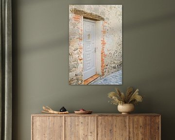 Pastel blue door in a village in the South of France by Jasmijn Brussé