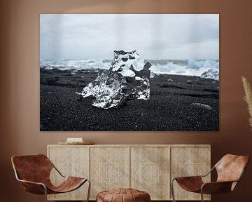 crystal clear ice rocks on black sand near glacier lagoon Jokulsarlon by Jutta Klassen