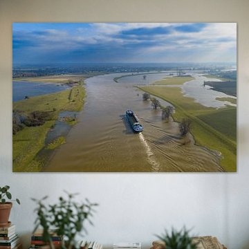 Freight ship sailing on the IJssel river with high water level by Sjoerd van der Wal Photography