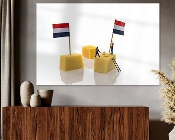 little people putting flags on dutch cheese