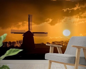 Sonnenaufgang mit Windmühle im Polder von Arjen Schippers