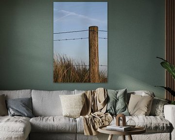 Pole with barbed wire by Marit Visser